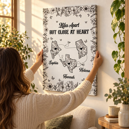 Hands straightening the personalized canvas on the wall