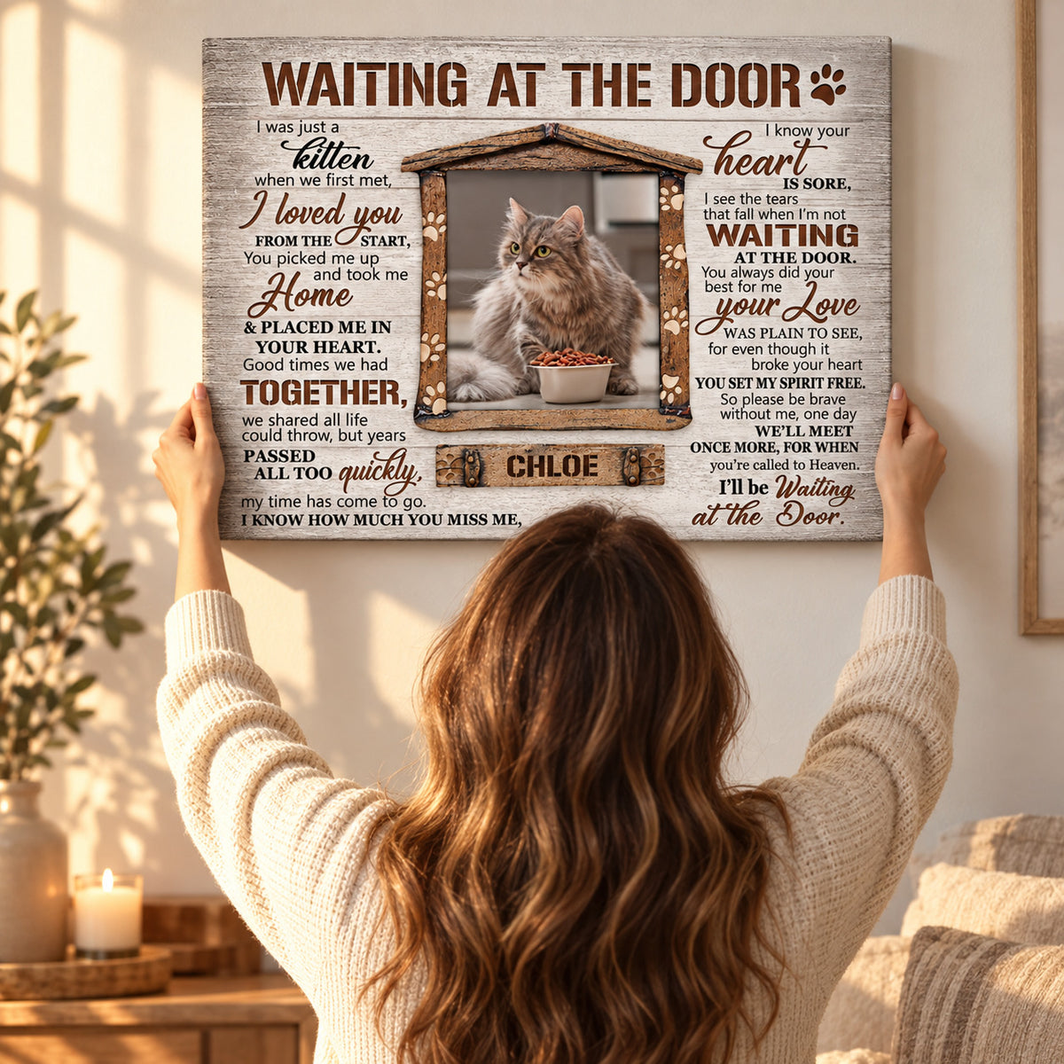 Waiting at the Door – Cat Memorial Gift – Personalized Canvas / Poster — Hands straightening the frameless canvas on the wall